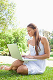 Woman on the lawn with her laptop