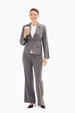 Smiling businesswoman holding cup of coffee 
