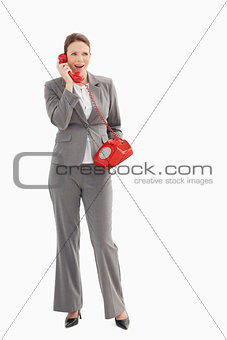 Surprised businesswoman talking on the phone