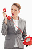 Businesswoman shouts down the phone