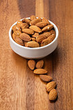 roasted almonds in white porcelain bowl