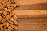 roasted almonds on wooden table