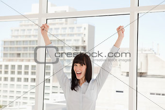 A business woman celebrating