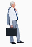 Profile of a cool businessman with a suitcase