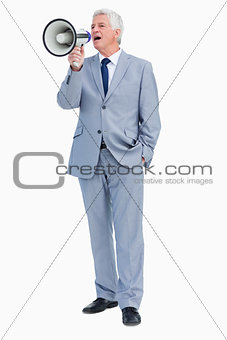 Businessman shouting with megaphone