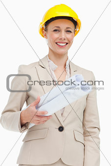 Portrait of a woman in a suit wearing a safety helmet 
