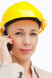Portrait of a businesswoman on the phone wearing safety helmet