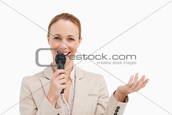 Portrait of a businesswoman speaking with a microphone 