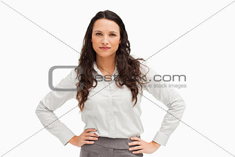 Portrait of a brunette businesswoman hands on hips