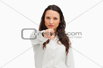 Portrait of a brunette pointing 