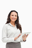 Portrait of a brunette standing while using a touchpad