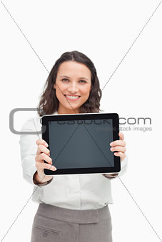 Portrait of a brunette showing a touchpad screen