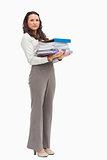 Woman carrying a lot of files 