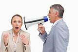 Businessman using a megaphone after his colleague