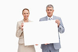 Business people holding a poster