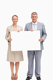 Business people smiling while holding a poster