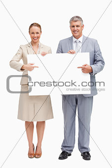 Business people showing a poster
