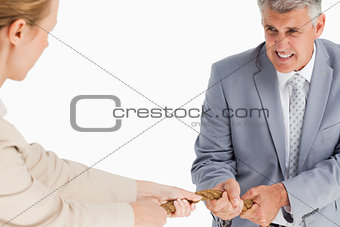 Businessman pulling a rope