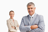Smiling business people with folded arms