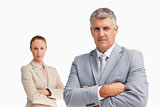 Two business people with folded arms 