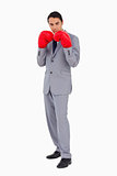 Man in a suit wearing boxing gloves 