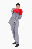 Businessman wearing red boxing gloves 