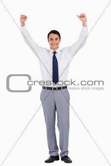 Businessman raising his arms