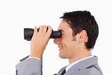 Close-up of a businessman using binoculars 