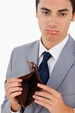 Portrait of a man in a suit with an empty wallet 