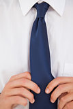 Man making a tie knot 