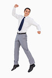 Businessman raising his arms and jumping