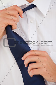 Man undoing his tie 
