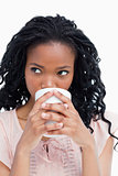 Close up of a woman drinking out of a cup