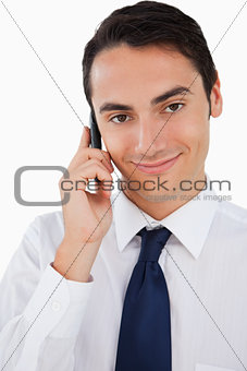Close-up of a handsome man calling with his cellphone