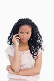 An angry woman talking on her mobile phone