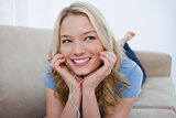 A smiling woman is listening to music with her earphones