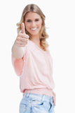 Focus shot of a woman with her thumb up