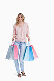 Full length shot of a woman carrying shopping bags 