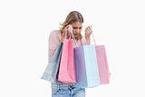A woman is carrying shopping bags 