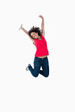 Happy young woman jumping in the air