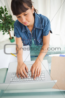 High-angle view of a student doing her homework