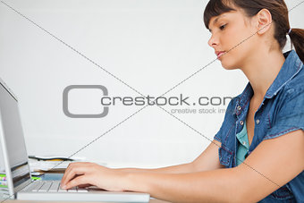 Side view of a student doing her homework