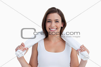 Young woman holding a towel around her neck