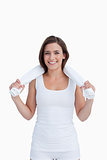Smiling brunette holding a white towel