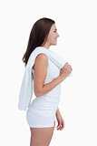 Smiling woman looking away while holding a towel