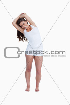 Smiling woman stretching herself
