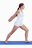 Smiling woman stretching her arms while standing upright