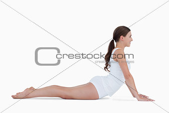 Young brunette practicing gymnastics