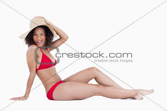 Attractive woman blinking an eye while sitting down