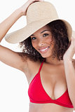 Smiling woman wearing a straw hat